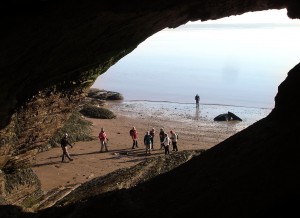 Looking out from inside a huge sea cave at the Hopewell Rocks